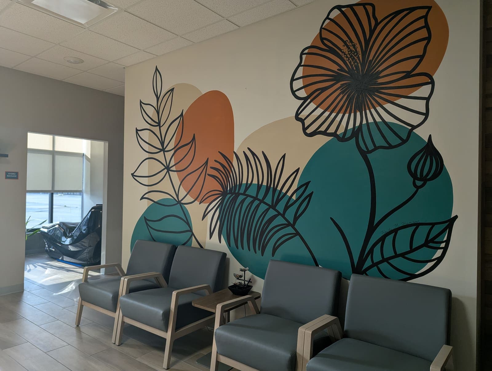 Waiting area with floral mural